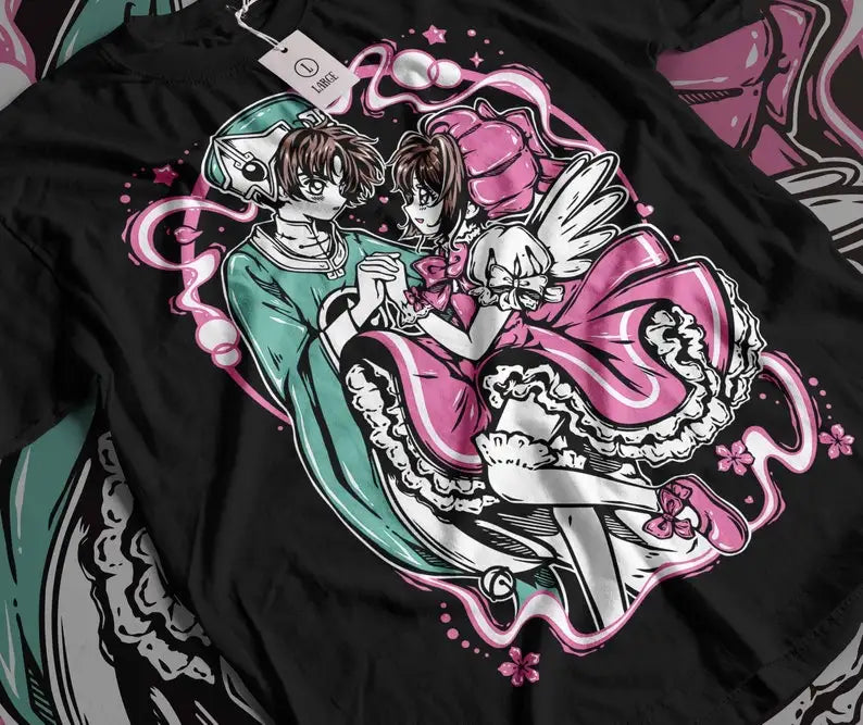 Here at Everythinganimee we only have the best shirts in the world! Step into the magical world of Cardcaptor Sakura with this enchanting Sakura & Shaoran Tee, capturing the sweet and iconic moment between two beloved characters. Designed for fans who cherish the heartwarming bond and whimsical style of the series,
