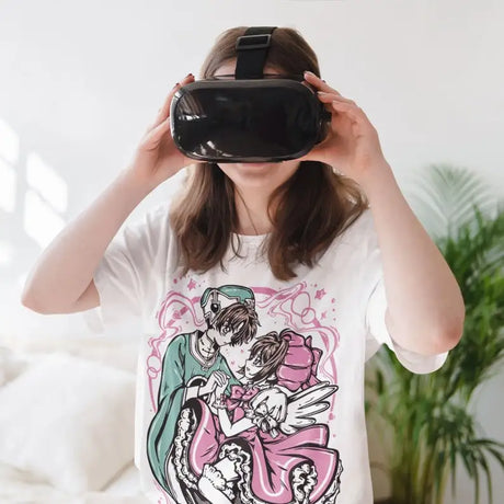 Here at Everythinganimee we only have the best shirts in the world! Step into the magical world of Cardcaptor Sakura with this enchanting Sakura & Shaoran Tee, capturing the sweet and iconic moment between two beloved characters. Designed for fans who cherish the heartwarming bond and whimsical style of the series,