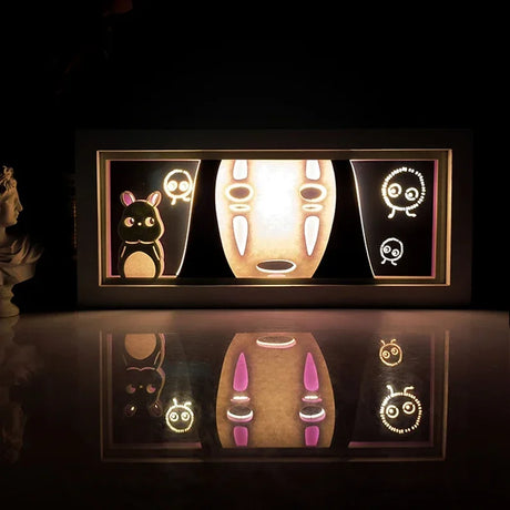 Showcase No-Face, the enigmatic spirit, with this mesmerizing Light Box that enchants viewers. If you are looking for more Spirited Away Merch, We have it all! | Check out all our Anime Merch now.