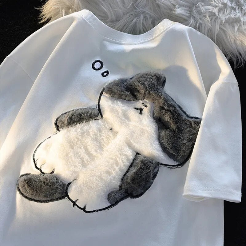 Dive into a world where cute meets comfort with our Cat Plush Embroidered T-shirt. If you are looking for more Cat Anime Merch, We have it all!| Check out all our Anime Merch now!