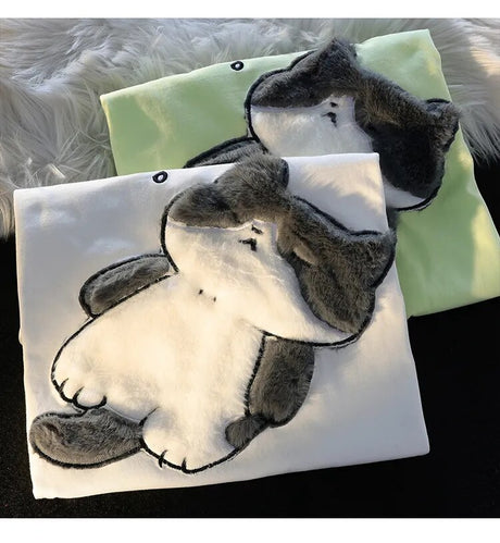 Dive into a world where cute meets comfort with our Cat Plush Embroidered T-shirt. If you are looking for more Cat Anime Merch, We have it all!| Check out all our Anime Merch now!