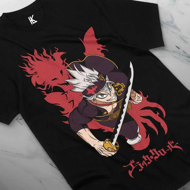 Here at Everythinganimee we have the best anime shirts in the world.
Embrace the power of the Black Bulls with the Asta Shadow Strike Tee! This bold design showcases Asta, the determined magic-less hero, wielding his sword with unmatched energy and intensity.