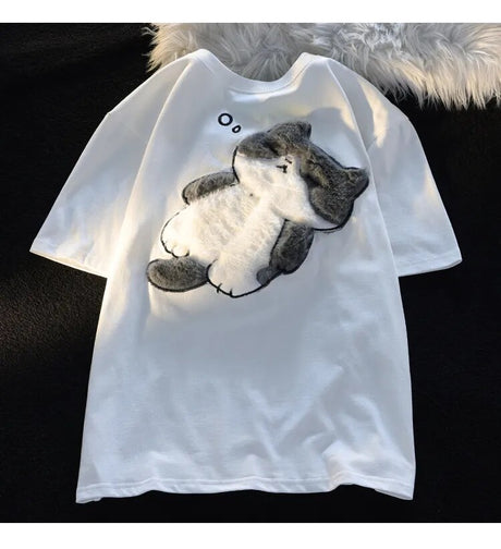 Dive into a world where cute meets comfort with our Cat Plush Embroidered T-shirt. If you are looking for more Cat Anime Merch, We have it all!| Check out all our Anime Merch now!