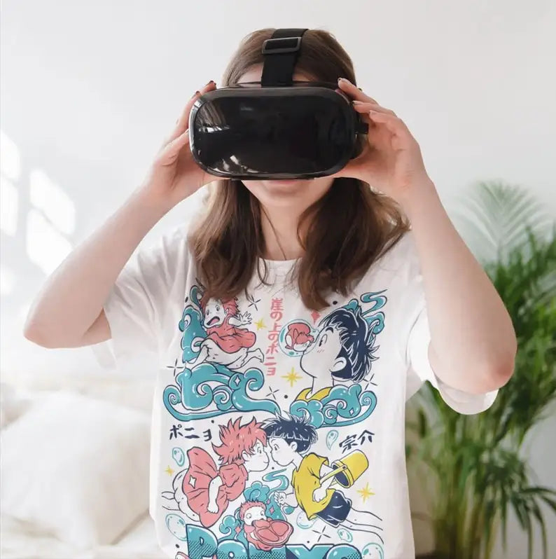 Here at Everythinganimee we only have the best shirts in the world! This vibrant tee captures the whimsical charm of Ponyo and Sosuke from the beloved anime movie "Ponyo." Featuring bold colors and a playful design, this shirt celebrates the enchanting underwater adventures and heartfelt bond between the two characters.