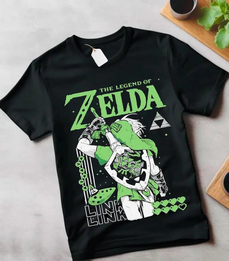Here at Everythinganimee we have the best anime shirts in the world.
Step into the world of Hyrule with this bold Legend of Zelda-inspired tee featuring Link in action. Showcasing his iconic green attire and Hylian shield, this shirt captures the essence of adventure and bravery.