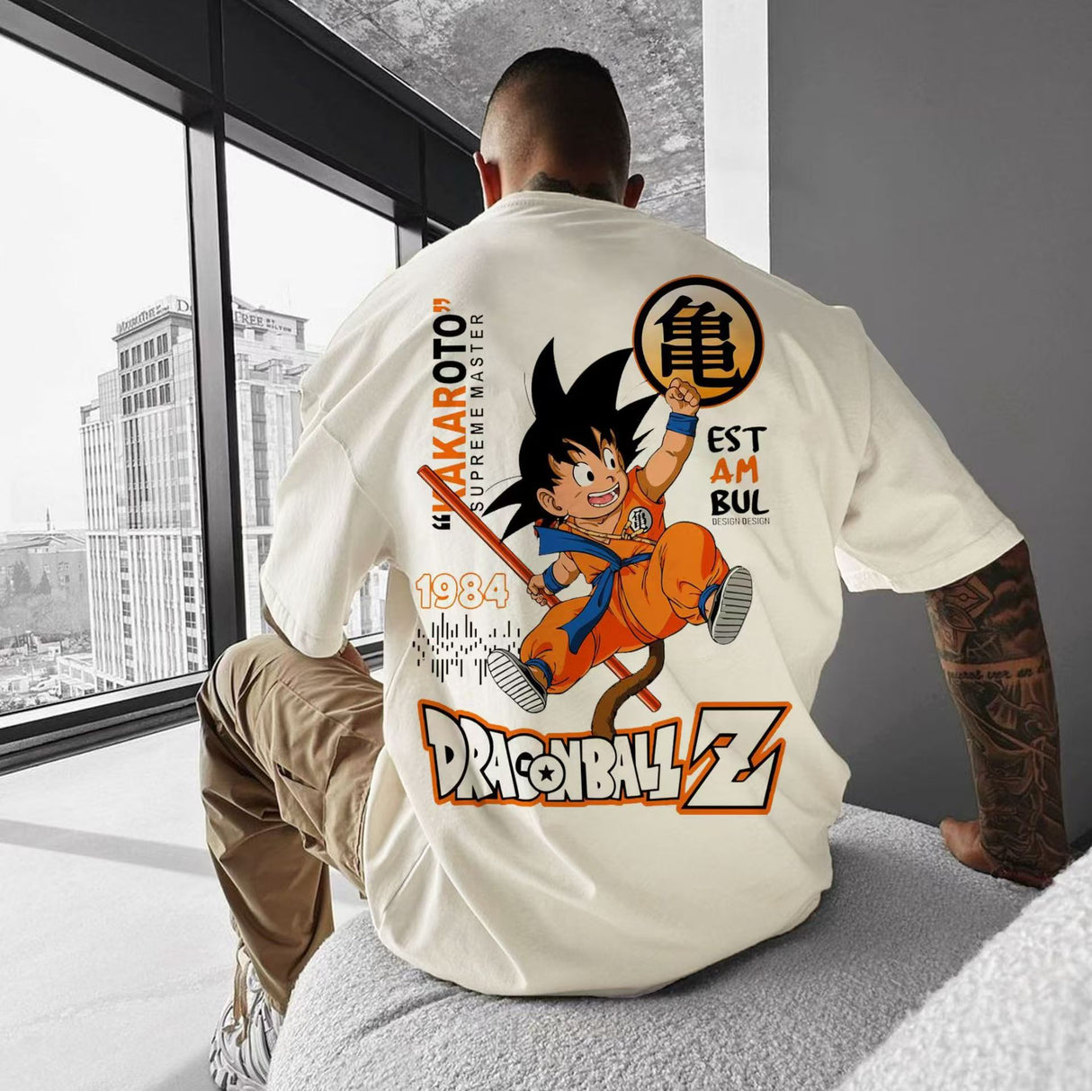 Here at Everythinganimee we only have the best shirts in the world! Relive the early days of Dragon Ball Z with the Kid Goku Retro Adventure Tee, celebrating Goku’s spirited beginnings. Featuring a nostalgic design of young Goku in his classic orange gi, this tee blends playful vintage style with modern streetwear flair. 