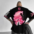 Here at Everythinganimee we only have the best shirts in the world! Step into the dark and powerful aura of Majin Buu with the Majin Buu Shadow Tee, featuring a striking, moody design of the iconic Dragon Ball Z villain. This shirt captures Majin Buu’s sinister silhouette in a vivid pink and black palette, with lightning effects that bring the artwork to life.