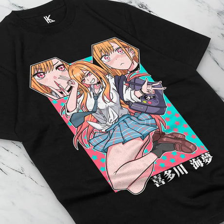 Here at Everythinganimee we have the best anime shirts in the world.
Celebrate your love for My Dress-Up Darling with this fun and expressive Marin Kitagawa tee. Featuring her bold and vibrant expressions, this shirt is a perfect tribute to Marin's playful and passionate personality.