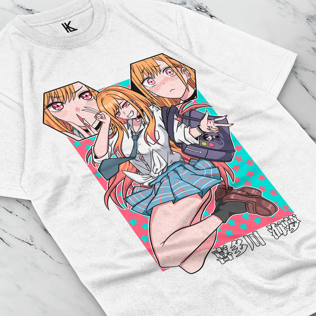 Here at Everythinganimee we have the best anime shirts in the world. 
Show off your love for Marin Kitagawa with this playful and vibrant tee! Featuring a lively design that captures Marin’s expressive personality.