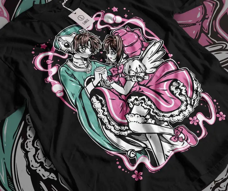 Here at Everythinganimee we only have the best shirts in the world! Step into the magical world of Cardcaptor Sakura with this enchanting Sakura & Shaoran Tee, capturing the sweet and iconic moment between two beloved characters. Designed for fans who cherish the heartwarming bond and whimsical style of the series, 