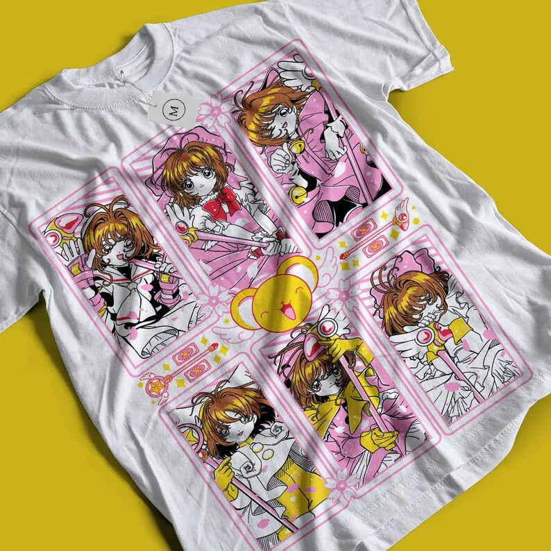 Here at Everythinganimee we only have the best shirts in the world! Embrace the magic with our stunning Cardcaptor Sakura Tee, featuring the beloved Sakura Kinomoto in her most iconic battle stances. This shirt captures the essence of Sakura's magical adventures, showcasing detailed and vibrant illustrations that will make any fan's heart flutter. Made from soft, breathable cotton, 