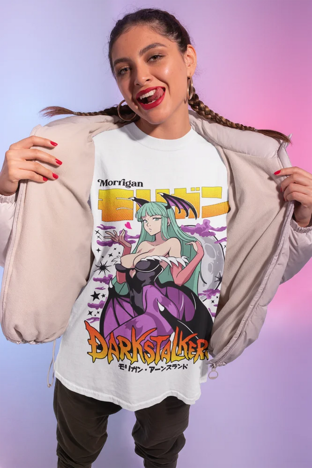 Here at Everythinganimee we have only the best anime merch! Free Global Shipping.
Step into the world of Darkstalkers with this eye-catching Morrigan Aensland graphic tee, showcasing the iconic and alluring succubus in vivid detail. Crafted with premium materials, this shirt captures Morrigan's striking presence and seductive charm,