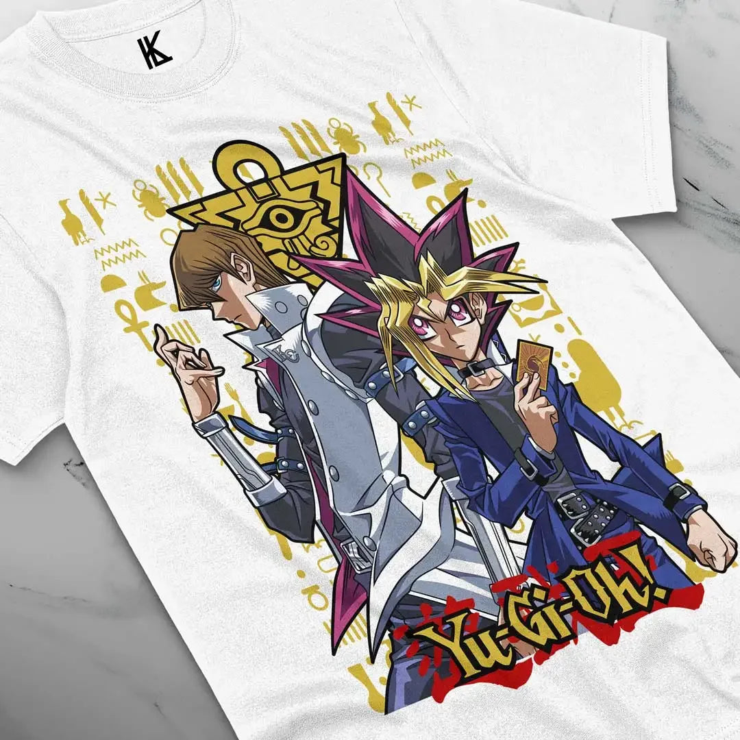 Here at Everythinganimee we have the best anime shirts in the world.
Step into the dueling arena with the legendary Yugi and Seto Kaiba, captured in this stunning tee from Yu-Gi-Oh!. Featuring intricate symbols and a dynamic pose, this shirt brings the thrill of the card game to life.