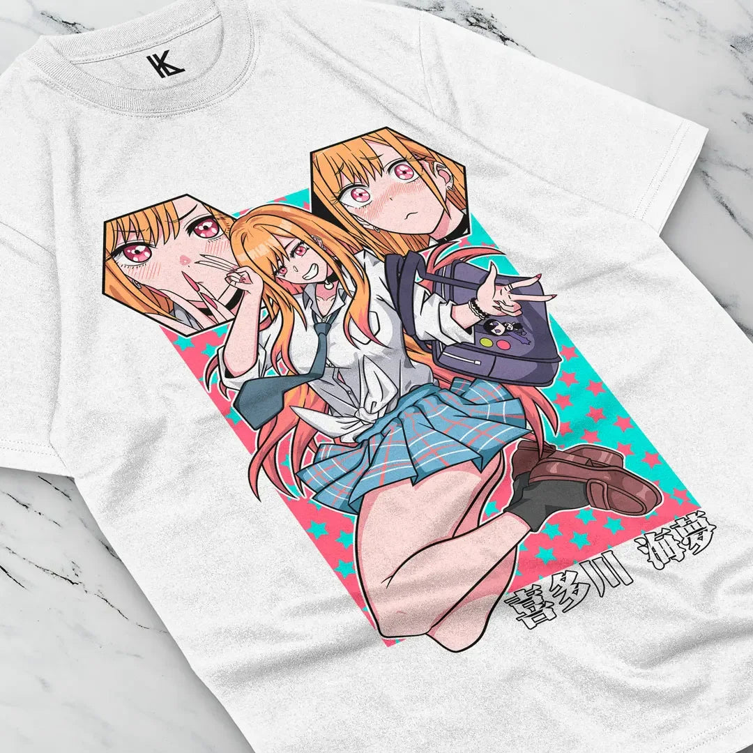 Here at Everythinganimee we have the best anime shirts in the world.
Celebrate your love for My Dress-Up Darling with this fun and expressive Marin Kitagawa tee. Featuring her bold and vibrant expressions, this shirt is a perfect tribute to Marin's playful and passionate personality.