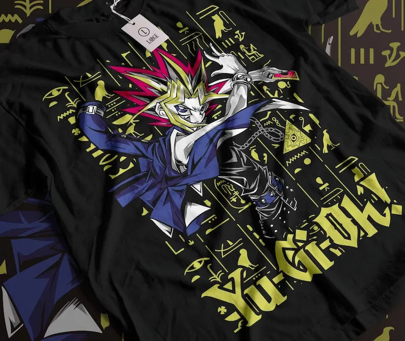 Here at Everythinganimee we only have the best shirts in the world! Unleash the power of the Millennium Puzzle with the Pharaoh Atem Tee, featuring the iconic Yu-Gi-Oh! character in his legendary pose. This shirt showcases the Pharaoh's fierce determination and mastery of ancient magic,