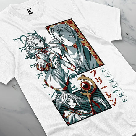 Here at Everythinganimee we have the best anime shirts in the world.
Embark on an enchanted journey with this captivating Frieren Mystic Journey Tee, featuring the serene and mystical elven mage from Beyond Journey’s End. 