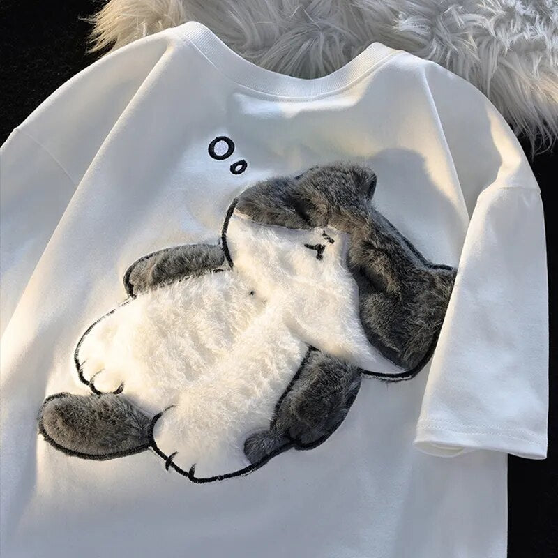 Dive into a world where cute meets comfort with our Cat Plush Embroidered T-shirt. If you are looking for more Cat Anime Merch, We have it all!| Check out all our Anime Merch now! 