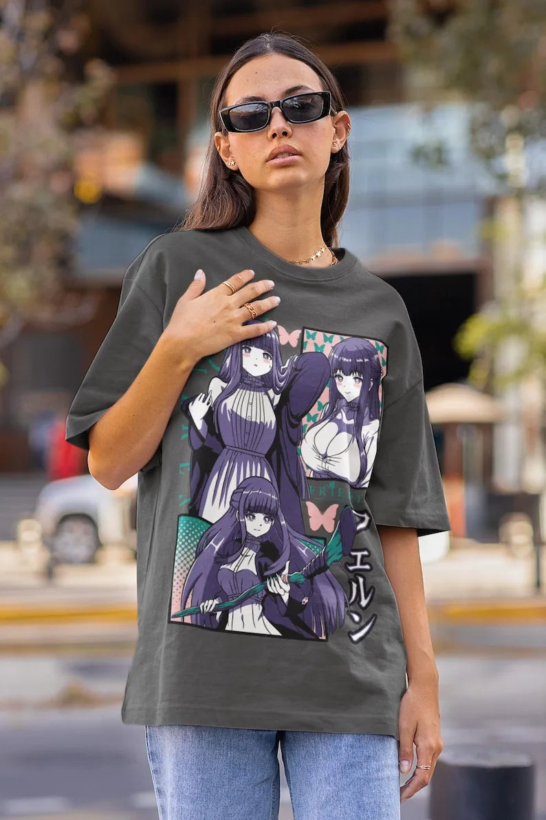 Here at Everythinganimee we only have the best shirts in the world! Step into the world of Frieren: Beyond Journey's End with this bold Fern graphic shirt that captures the elegance and power of one of the series' most compelling characters. Designed for ultimate comfort, this tee perfectly blends style and fandom, showcasing vivid colors and intricate detailing that anime lovers will appreciate. 