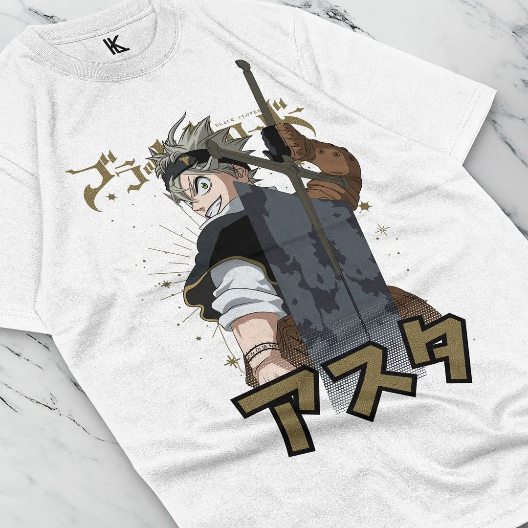 Here at Everythinganimee we have the best anime shirts in the world.
Step into the world of Black Clover with this striking Asta-themed tee. Featuring the determined and powerful protagonist, Asta, in mid-battle stance with his iconic sword, this shirt captures the fierce energy of the series.