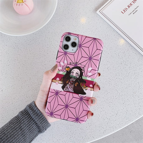 Get the cutest phone protection with our Demon Slayer anime phone case for iPhone 11, 12, 13, Pro, 7, 8 Plus, X, XR, XS Max. Show off your love for the series with this soft TPU cover featuring the iconic characters from Kimetsu No Yaiba. Shop now on our website!