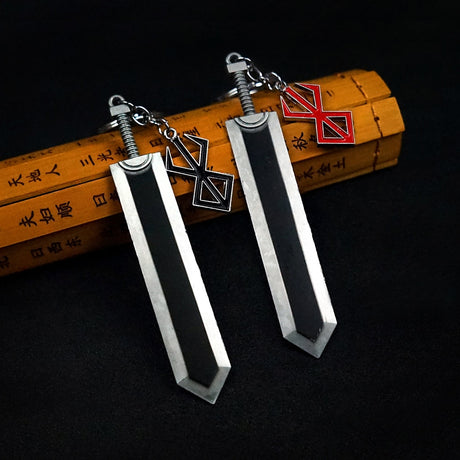 Shop now for the ultimate Berserk fan accessory - the Berserk Guts Sword Keychain Set! Made of durable zinc alloy, these keychains feature a detailed design of Guts' iconic sword and are perfect for showing off your love for the anime. Get them for yourself or as a gift for the Berserk fan in your life.